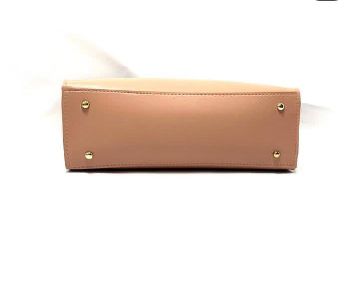 Peach trapeze top-hand bag